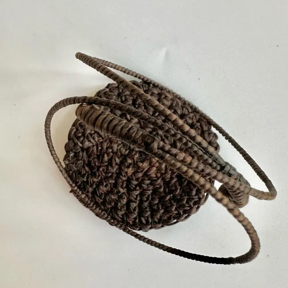 Round  black beaded bracelet on brown cord
